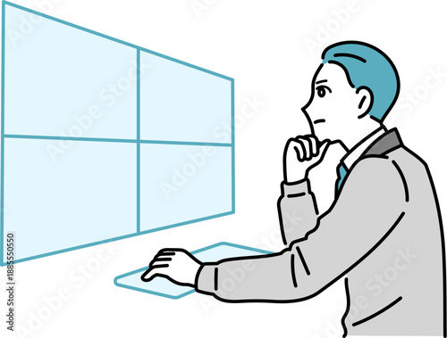 デスクで作業をしている作業着の男性のイラスト