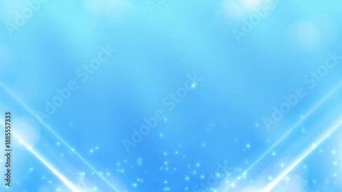 Soft clean Beauty background. Light blue abstract with gentle motion bokeh and dust Particles