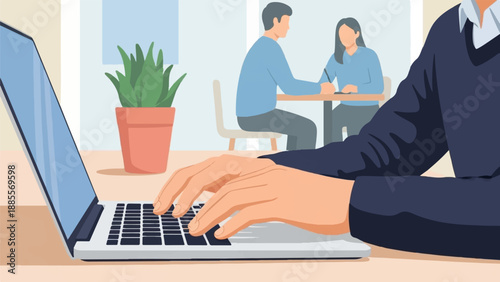 Closeup of hands typing on laptop, two people collaborate in background