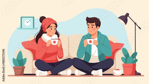 Cozy couple enjoying warm beverages in a relaxed living room setting