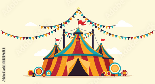 Classic colorful circus tent with red and yellow stripes decorated with festive bunting flags against a clear sky with soft white clouds.