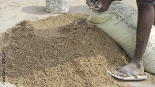 Hand at Work  Sorting Grains from Dirt