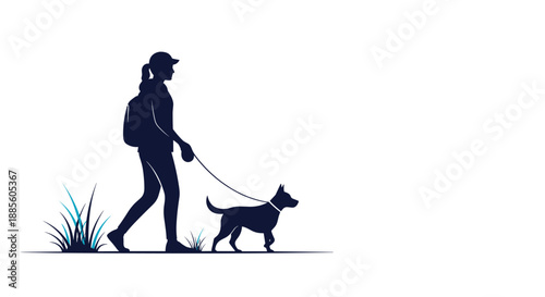 Silhouette of a woman wearing a backpack and cap walking her dog on a leash through a grassy field at sunset.