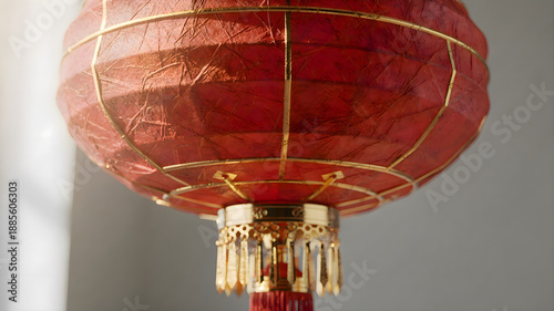 Close up of red chinese lantern hanging from ceiling, traditional asian decoration for festive celebration and cultural holiday atmosphere
