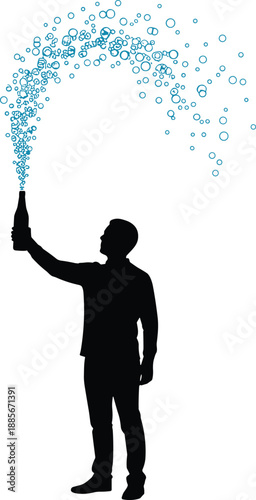 ilhouette of a man celebrating by opening a bottle of champagne with blue sparkling bubbles spraying in the air for a party celebration