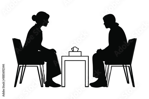 Foto silhouette of two people sitting on chairs facing each other at a table with a t
