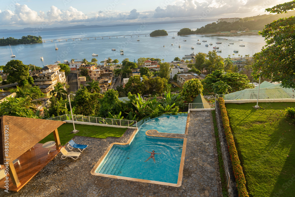 Fototapeta premium Woman enjoying sunset at hotel in Samana, Dominican Republic
