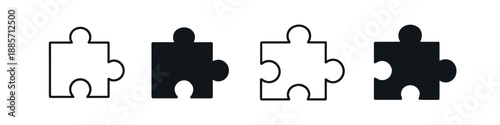 Two black and two white puzzle pieces arranged in a row on a white background