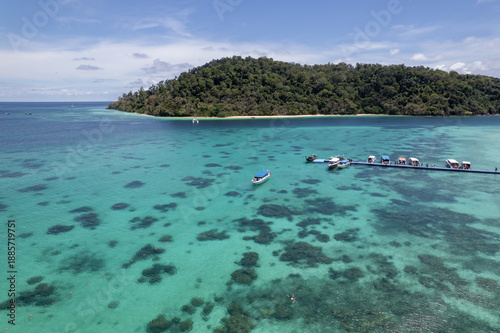 Tropical paradise white sand beach with palm trees on Koh Rok, Mu Ko Lanta National Park.