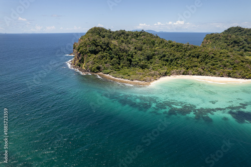 Tropical paradise white sand beach with palm trees on Koh Rok, Mu Ko Lanta National Park.