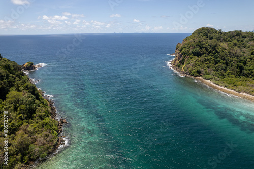 Tropical paradise white sand beach with palm trees on Koh Rok, Mu Ko Lanta National Park.
