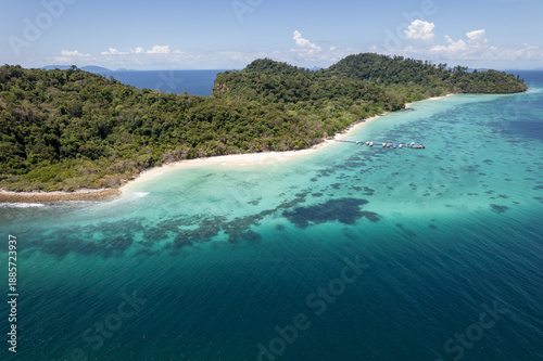 Tropical paradise white sand beach with palm trees on Koh Rok, Mu Ko Lanta National Park.