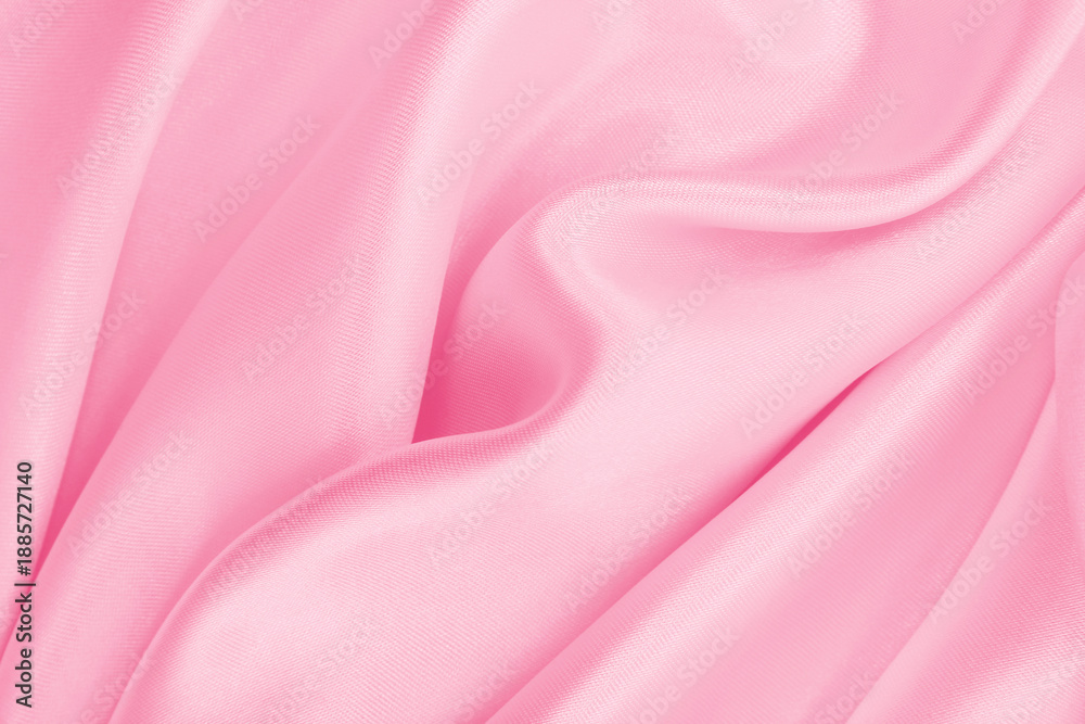 Fototapeta premium Smooth elegant pink silk or satin texture as wedding background. Luxurious background design