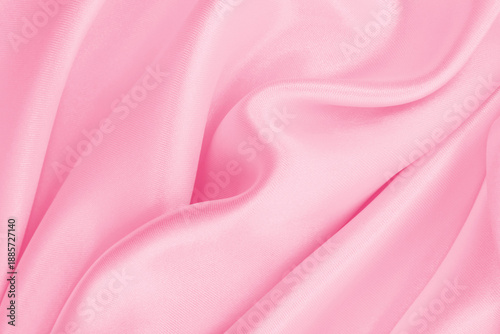 Smooth elegant pink silk or satin texture as wedding background. Luxurious background design