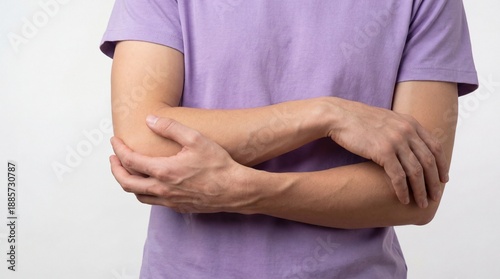Wallpaper Mural Person with arms crossed in front of body wearing purple shirt. Torontodigital.ca