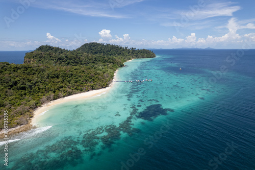 Tropical paradise white sand beach with palm trees on Koh Rok, Mu Ko Lanta National Park.