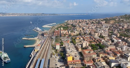 Aerial panoramic view of Villa San Giovanni, located in the Metropolitan City of Reggio Calabria, Italy. It is a port city overlooking the Strait of Messina. Across the sea is the coast of Sicily.