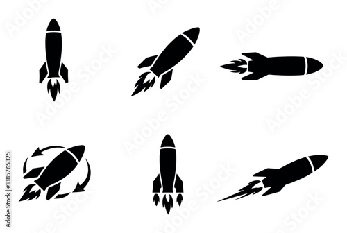 Black silhouette variety of rockets in different directions on white background