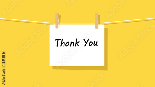 A heartfelt "Thank You" message handwritten on a white card, suspended by clothespins on a string against a vibrant yellow background.