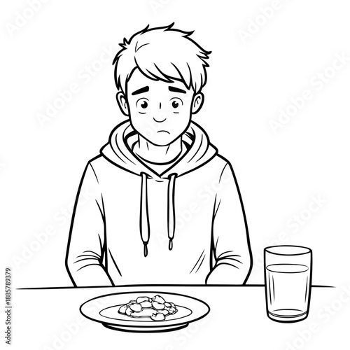 Sad teenage boy with messy hair in a hoodie sitting at the table with food and water