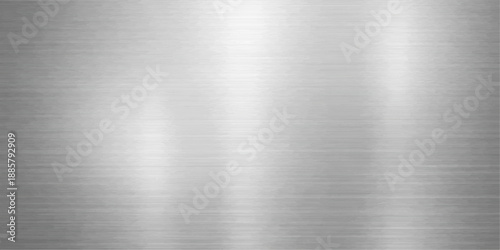 Industrial brushed metal plate texture featuring a polished silver steel surface with a shiny metallic pattern on a grey stainless aluminum sheet background