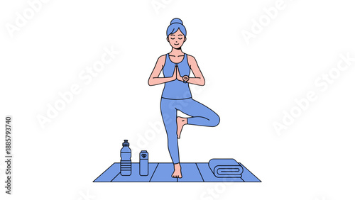 A serene woman performs the Vrikshasana, or Tree Pose, in yoga, demonstrating balance and mindfulness on a mat alongside her water bottle and towel.