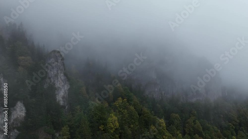 Time-lapse video of fog flowing over a rocky cliff