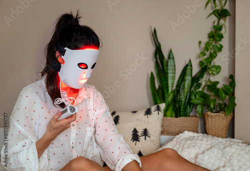Woman using Led Light Facial Mask Treatment