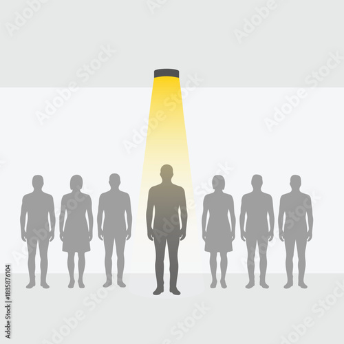 A spotlight shines on a single person standing out from a group of people