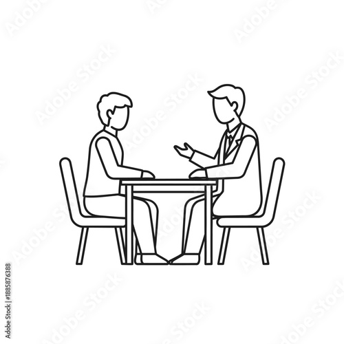 Two men having a conversation at a table.