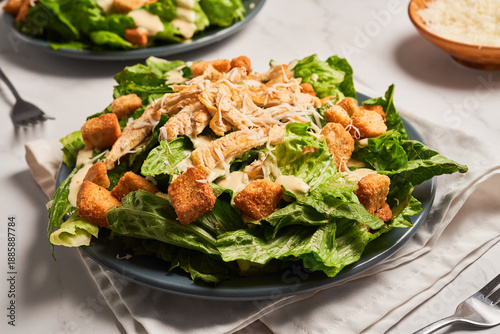 Bild auf Leinwand Classic caesar salad with grilled chicken fillet and parmesan cheese