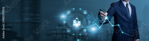 Obraz na płótnie Businessman touches urban data chart with pen and performs evaluation on smart city infrastructure, IoT solutions, sustainable planning, and technology-driven urban management