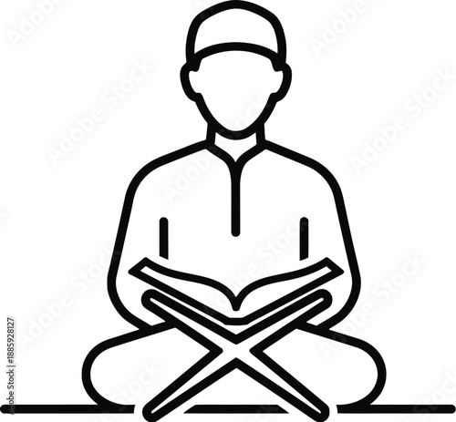 Man sitting cross legged reading book