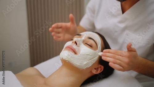 Wallpaper Mural Young Woman Receiving Facial Mask Treatment from Professional Male Beautician Torontodigital.ca