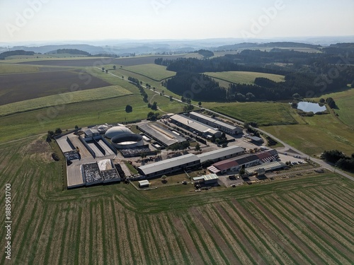 Obraz na plátne Aerial panorama of biogas power plant and surrounding agricultural landscape sho