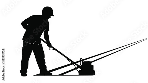 a worker using a weed whacker with a distinct silhouette