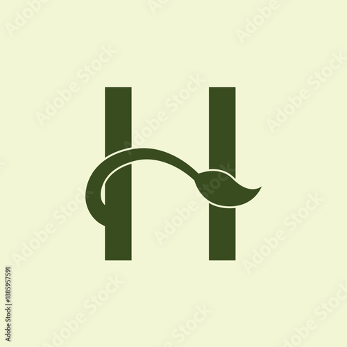 Logo minimaliste lettre H avec feuille, symbole nature, écologie et identité visuelle durable