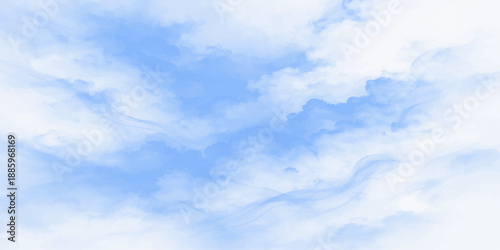 A beautiful clear blue sky features bright white fluffy cumulus clouds on a sunny summer day creating a peaceful nature atmosphere