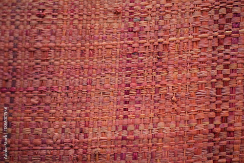 Cuadro en lienzo Red pink woven raffia straw texture background