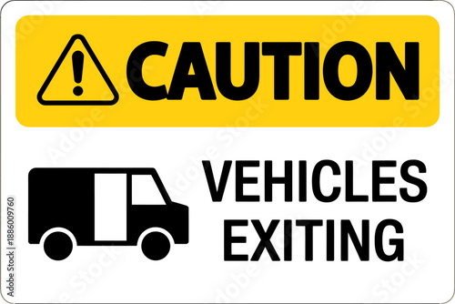 Yellow caution sign warning of vehicles exiting driveway