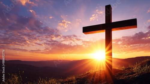 The Christian concept. Wooden cross on Mount Golgotha against a background of wild grass and the sun at sunset.