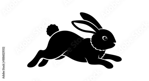 Silhouette of a running black rabbit in motion.
