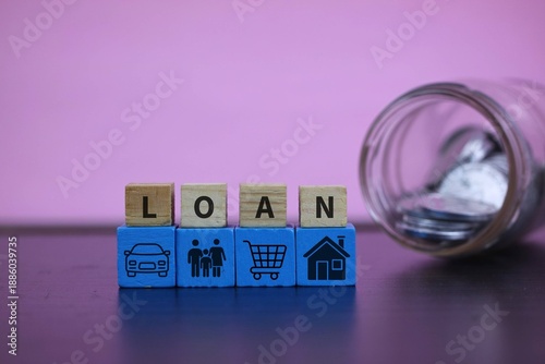 Photography A visual set of wooden blocks spelling LOAN with blue icon blocks representing car, family, shopping cart, and home