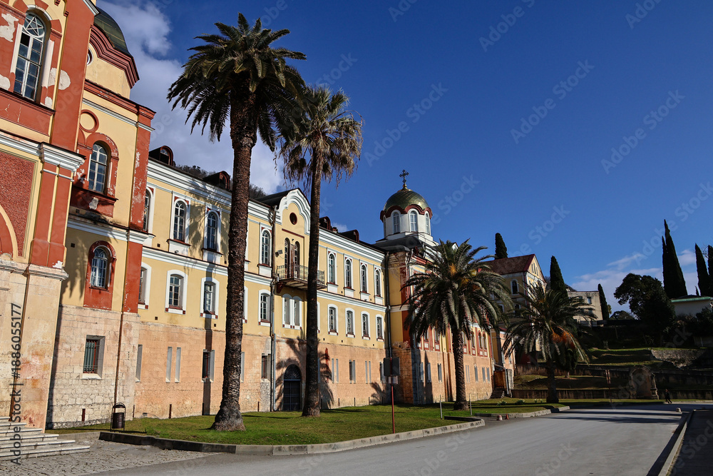 Naklejka premium New Athos Monastery buildings on a sunny day in Abkhazia.