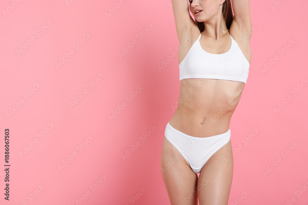 Fototapeta premium Woman with perfect body on pink background, closeup. Space for text