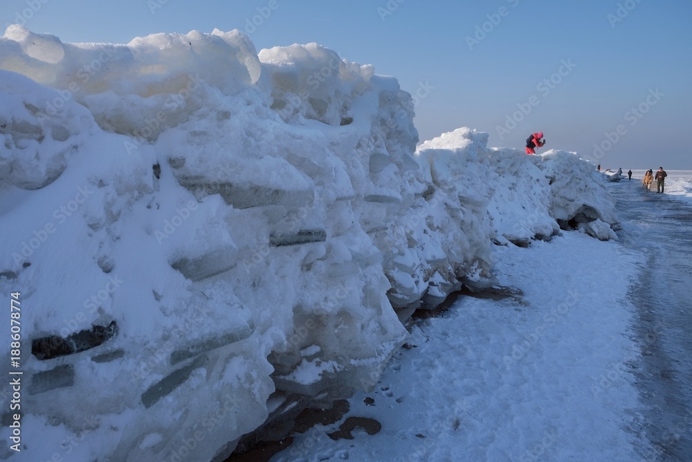custom made wallpaper toronto digitalIce toros (mountains of piled-up ice) on the beach in Mikoszewo, Baltic Sea, Pomerania, Poland. This is a very interesting and rare phenomenon. Little silhouettes of walking people.