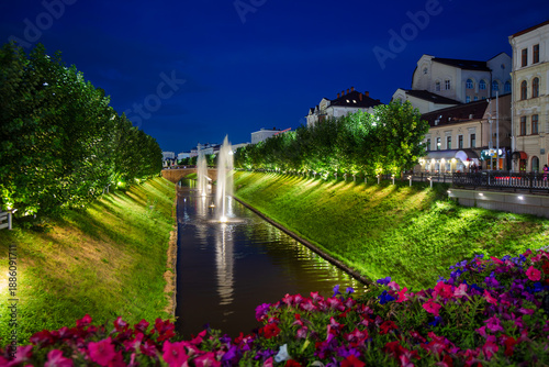 Bulak Canal, the city of Kazan, Republic of Tatarstan, Russia. Beautiful evening cityscape. View of fountains in the middle of the Bulak channel. Night illumination of the canal banks.