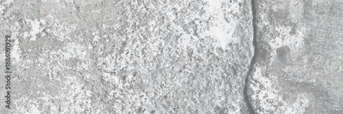 Texture of old cracked concrete wall. Rough gray concrete surface. The gap between the reinforced concrete slabs. Perfect for background and design. Close-up. High resolution.