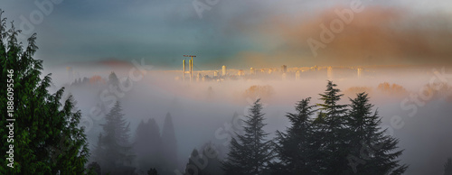 Obraz na plátně This is a dreamy and wintery composite image taken early in the morning with abundance of mist and fog laying low over the Fraser River with partial city views of New Westminster and Coquitlam Canada
