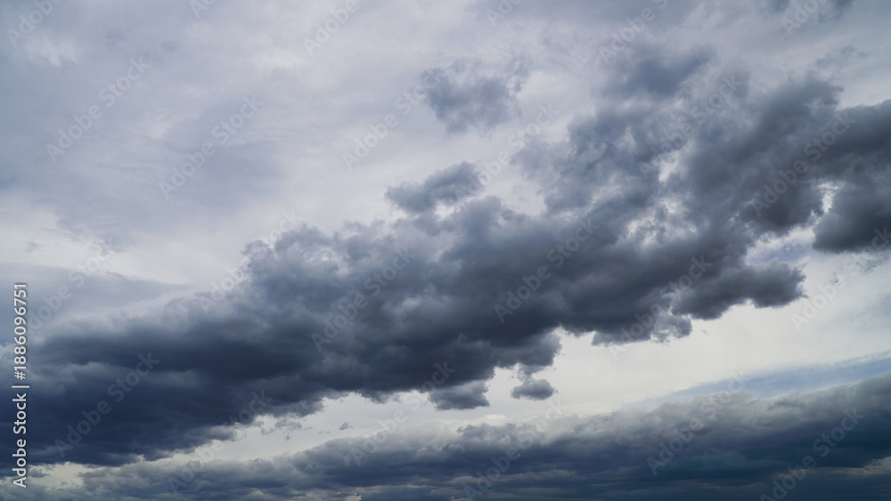Obraz premium Cumulonimbus clouds over grey sky a moody dramatic atmosphere weather
